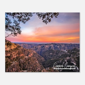 May include: A panoramic view of a canyon with a colorful sunset sky. The text "Copper Canyon" is written in white at the bottom of the image.