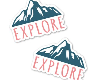 May include: Two white stickers with a blue mountain silhouette and the word "EXPLORE" in pink text.