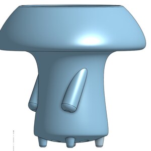 May include: A light blue ceramic planter shaped like a mushroom with a wide, rounded top and a slender stem. The planter has four small feet and two small, rounded protrusions on the stem.