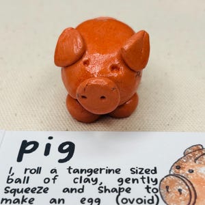 terracotta pig, left in natural clay to dry and then glaze