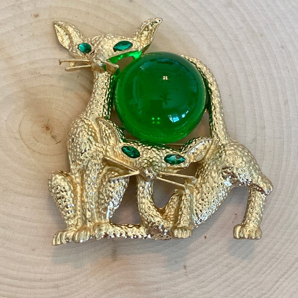 Large cat brooch with green stones