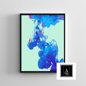 May include: Abstract art print in a black frame. The artwork features a dynamic composition of swirling blue and red ink against a light green background. The print includes the text "Art Prynt Able" in a white square.