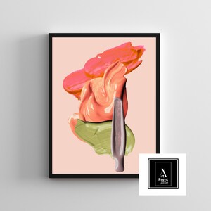 May include: Abstract art print featuring layered brushstrokes of coral, peach, and olive green paint on a pale pink background. A dark brown applicator is centered. The artwork is framed in a black border.