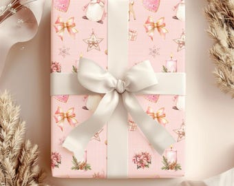May include: A pink gift box with a white ribbon and a festive Christmas pattern. The pattern includes gnomes, stars, bows, candles, and snowflakes.