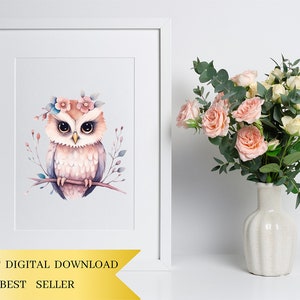 May include: A watercolor illustration of a pink owl with a flower crown, perched on a branch. The owl has large, brown eyes and a light pink body with white feathers. The background is a light blue watercolor wash.
