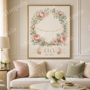 May include: A rectangular wall art print in a gold frame featuring a watercolor floral wreath of pink peonies and green eucalyptus leaves. Inside the wreath is a gold Morse code pattern. Below, a banner displays the name LILY and EST. 2023.