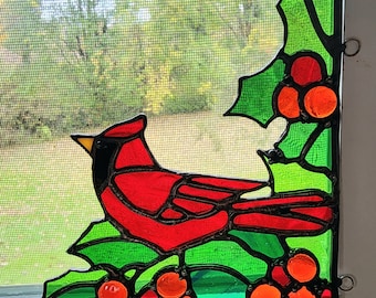 Stained glass window corner Cardinal sitting amongst Holly and berries, Christmas, anytime of the year