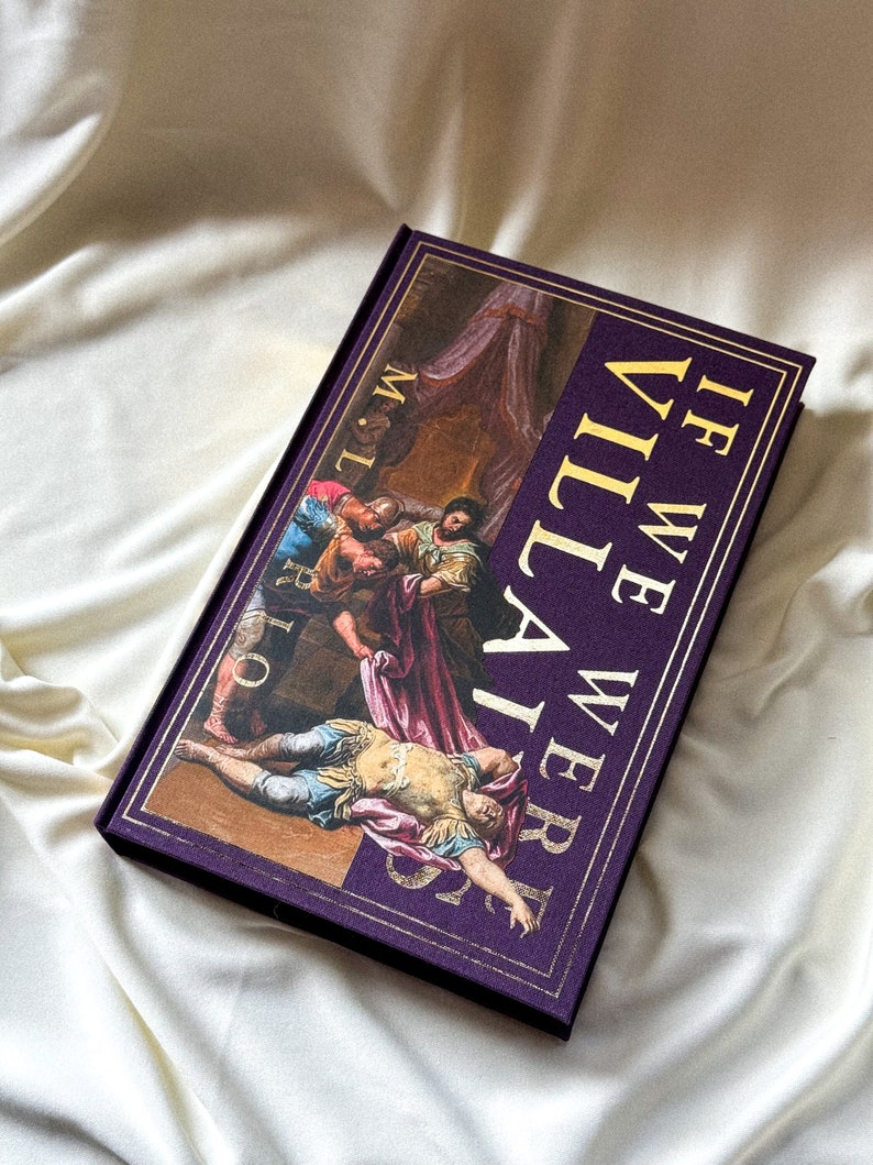 May include: A purple hardback book with gold lettering that reads "If We Were Villains". The cover features a painting of a scene from a play.
