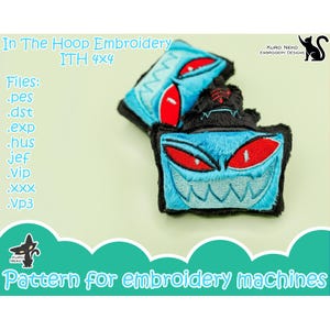 May include: Two embroidered patches with a monster face design. The patches are blue with red eyes and white teeth, outlined in black. The text "In The Hoop Embroidery" and "Pattern for embroidery machines" are also visible.