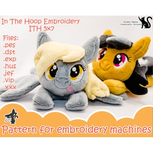 May include: Two plush toys, one gray with yellow eyes and a pink tongue, and one yellow with black hair and pink eyes, are lying on a white surface. The text "In The Hoop Embroidery ITH 5x7" is at the top of the image. The text "Files: .pes .dst .exp .hus jef .Vip .XXX" is below the toys. The text "KURO NEKO EMBROIDERY DESIGNS" is in the top right corner of the image. The text "Pattern for embroidery machines" is at the bottom of the image.