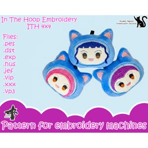 May include: Three blue plush cat-eared doll faces with embroidered features. Each doll has a different coloured hood: blue, pink, and purple. Text on the image reads "In The Hoop Embroidery" and "Pattern for embroidery machines."