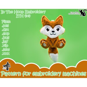 May include: A brown and white fox plush toy with a smiling face. The toy is in a 4x4 inch embroidery hoop. The text "In The Hoop Embroidery ITH 4x4" is at the top of the image. The text "Files: .pes .dst .exp .hus .jef .vip .sew xxx" is on the left side of the image. The text "KURO NEKO EMBROIDERY DESIGNS" is at the top right of the image. The text "Pattern for embroidery machines" is at the bottom of the image.