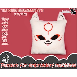 May include: White plush pillow with a red embroidered fox face. The fox has a red circle on its forehead and black eyes. The pillow is for embroidery machines and is available in 8x8 and 8x11 inch sizes. The text "The Hoop Embroidery ITH" is at the top of the image.