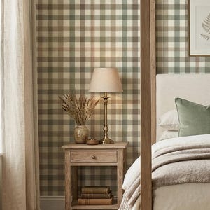 May include: Wallpaper featuring a large-scale gingham check pattern in muted shades of sage green, soft brown, and cream. The grid design consists of intersecting horizontal and vertical bands that create a repeating plaid effect across the wall surface.
