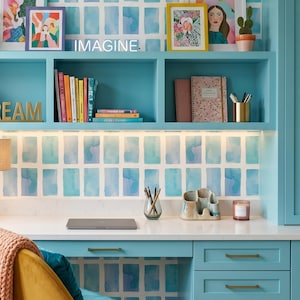 May include: A set of three ceramic mugs with a speckled, matte finish. The mugs are in shades of cream, light gray, and dark gray. Each mug has a simple, minimalist design, perfect for coffee or tea.