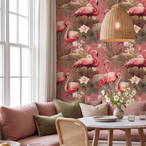 May include: A dining area with flamingo-themed wallpaper, a round table, and a woven pendant light. The room features a built-in bench with pink cushions and green throw pillows. A vase of white flowers sits on the table.