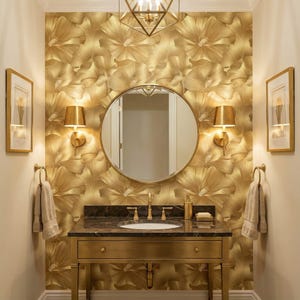 a luxurious bathroom with a gold-colored vanity, a round mirror, and gold-colored wall sconces. The walls are covered in a gold floral wallpaper, and the overall design has a warm and elegant appearance.