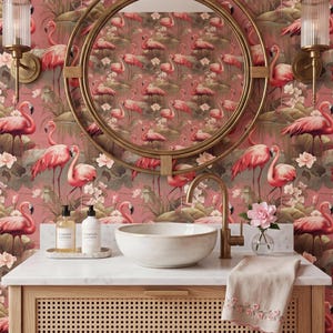 May include: A bathroom vanity with a marble countertop, a round mirror, and a flamingo-themed wallpaper. The vanity has a woven cane front and a gold faucet. Two sconces flank the mirror.