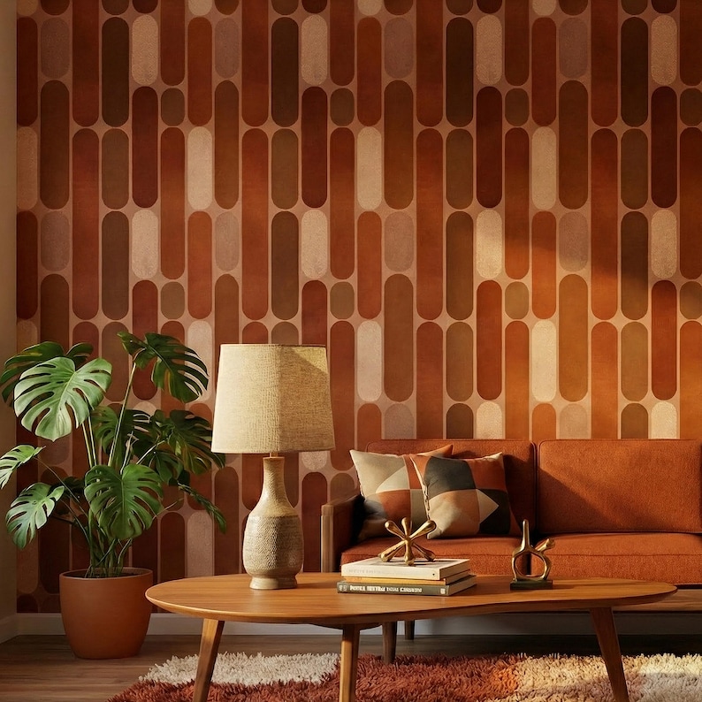 a modern living room with a wooden coffee table, a sofa, a lamp, and a potted plant. The walls are adorned with a patterned wallpaper in shades of brown and orange, creating a warm and inviting atmosphere.