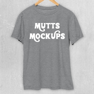 Gildan 5000 T-shirt, Heather Sport Grey | Mock-up Hanging on Wooden Hanger on Concrete Wall | JPG + PNG