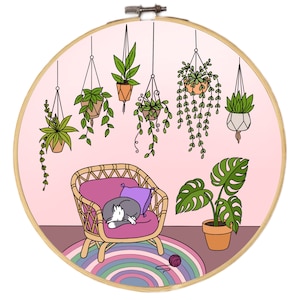 May include: A pink and white illustration of a cat sleeping in a wicker chair with a purple cushion. The cat is surrounded by hanging plants in a room with a pink wall and a rainbow rug.