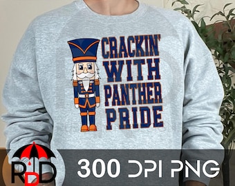 May include: A gray sweatshirt with a blue and orange nutcracker design. The text "Crackin' With Panther Pride" is printed on the sweatshirt.