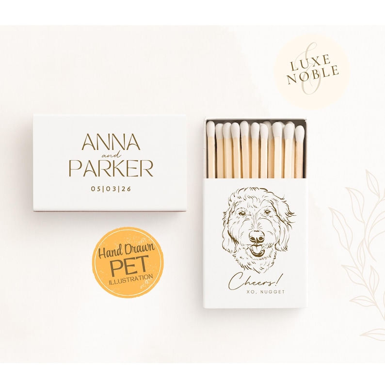 White wedding matchboxes with Light AI enhanced hand drawn dog illustration saying Cheers personalized with couple’s names and date by Luxe and Noble