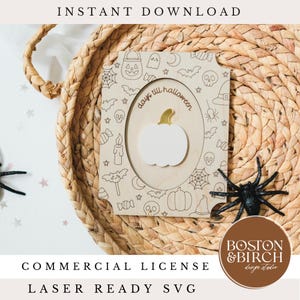 May include: A wooden Halloween countdown frame with a white pumpkin and gold stem. The frame is decorated with Halloween-themed illustrations and the text "days till halloween". A black spider is also present.