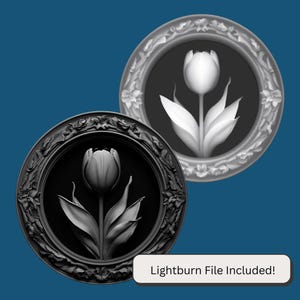 May include: Two black and white framed images of a single tulip flower. The frames are ornate and have a raised design. The text "Lightburn File Included!" is at the bottom of the image.