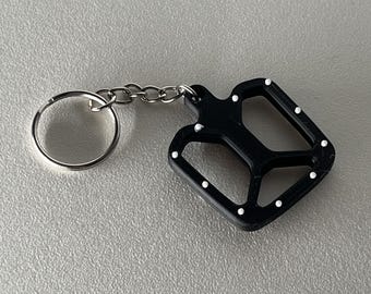 Llavero con pedal de bicicleta