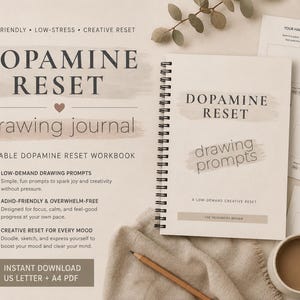 May include: A spiral-bound drawing journal titled Dopamine Reset with a beige cover, featuring matching printable workbook pages, a wooden pencil, and a ceramic mug of coffee. The text includes ADHD-friendly, low-stress, creative reset, and drawing prompts.