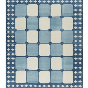 Handmade Swedish checkerboard wool rug featuring alternating sky blue and ivory squares with a traditional Nordic blue border in a Scandinavian flatweave design.