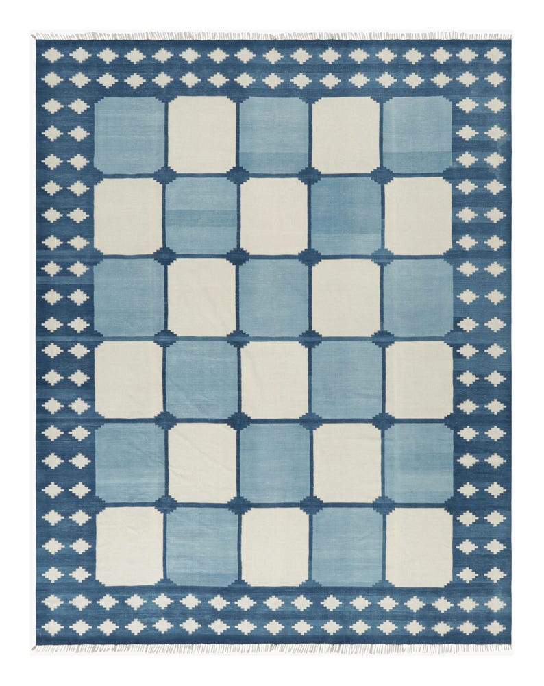 Handmade Swedish checkerboard wool rug featuring alternating sky blue and ivory squares with a traditional Nordic blue border in a Scandinavian flatweave design.