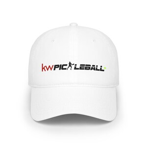 May include: White baseball cap with the text "kwPICKLEBALL" in red and black, featuring a pickleball player silhouette and a green pickleball. The cap has a curved peak and a structured fit.