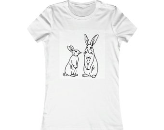 May include: A white t-shirt with a black line drawing of two rabbits looking at each other.