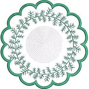 May include: A green embroidered design of a wreath with a spiral in the center. The wreath is made up of small leaves and the spiral is made up of small dots.