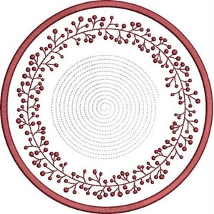 May include: A red embroidery hoop with a circular design of a wreath of berries and leaves. The center of the hoop is filled with a spiral pattern.