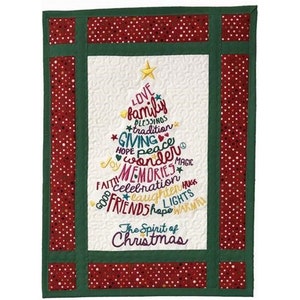 May include: A white quilted Christmas tree wall hanging with a green border and red polka dot fabric. The tree is decorated with colorful embroidered words that include "love", "family", "peace", "memories", and "the spirit of Christmas".