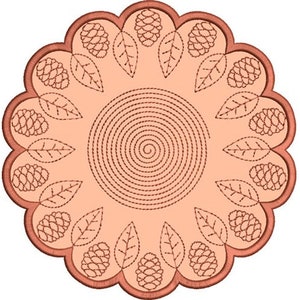 May include: A peach-colored round embroidery design with a spiral in the center and a border of leaves and pine cones.