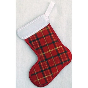 May include: A small Christmas stocking with a red plaid pattern, featuring green and gold accents. The stocking has a white cuff and a white loop for hanging. The edges are trimmed in red.
