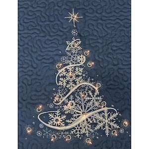 May include: A navy blue quilted fabric features an embroidered Christmas tree design. The tree is composed of silver snowflakes and illuminated with small, warm white lights. A star tops the tree, creating a festive holiday decoration.