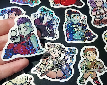 May include: A set of ten holographic stickers featuring various fantasy characters. The stickers are colorful and feature a variety of characters, including a goblin, a wizard, a fairy, and a dragon. The stickers are perfect for adding a touch of whimsy to your laptop, water bottle, or planner.