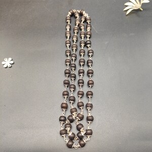 Full-length view of the mala laid flat showcasing bead shine and uniformity.