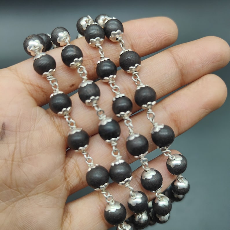 Close-up of the guru bead and German silver components.