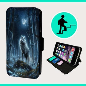 May include: A black phone case with a white wolf standing in a forest with a full moon in the background.