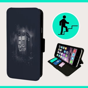 May include: A navy blue phone case featuring the TARDIS from Doctor Who with the words "BAD WOLF". The case is shown open with a phone inside, displaying the phone's home screen. The case also has card slots.
