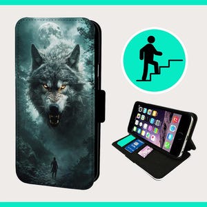 May include: A black phone case with a wolf illustration. The wolf is howling at the moon and is surrounded by trees. The case has a flap that covers the phone screen.