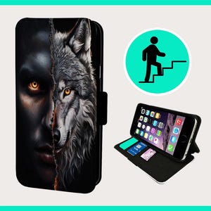 May include: Black phone case featuring a split design of a human face and a wolf's head with glowing yellow eyes. The case is open, displaying a phone with apps and a few card slots. A green circle with a person climbing stairs is also visible.