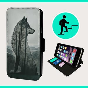 May include: A black phone case with a wolf silhouette design. The wolf is made up of trees and is set against a forest background. The case has a flap that folds over the phone.