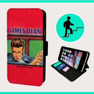 May include: A red leather phone case featuring a photo of James Dean. The photo shows James Dean in a car, wearing a black jacket and smoking a cigarette. The text "Rebel Without A Cause" is printed below the photo.